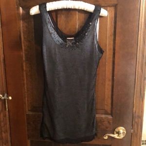 Sheer black sleeveless top.